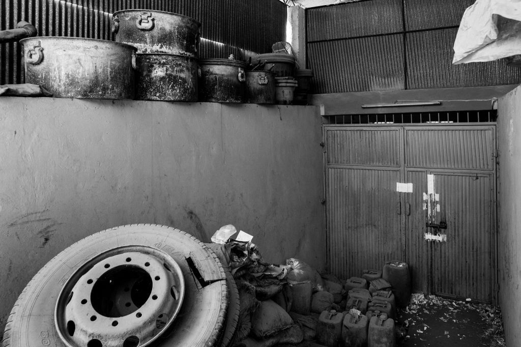 Cooking pots and chemicals used for heroin production, and a tyre used for smuggling lay in the Counter Narcotics Police headquarters. They will be used as evidence in future trials.
